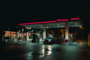 cars parked in front of store during night time